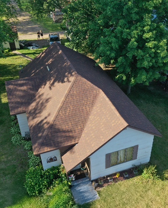 Above view of a house with a finished brown roof